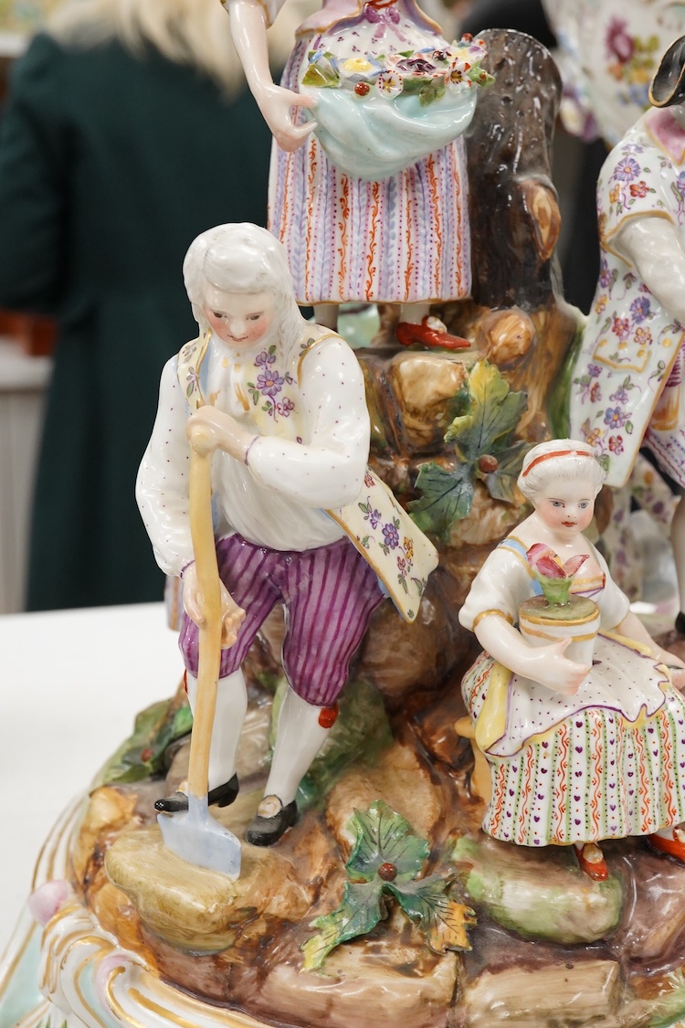 A pair of German porcelain figure groups, late 19th century and a Dresden centrepiece bowl-29cm high